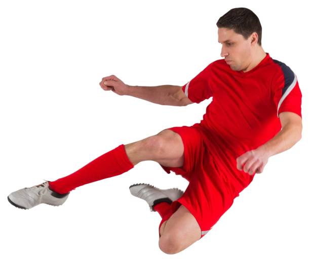 istock Fit football player jumping and kicking 834789522