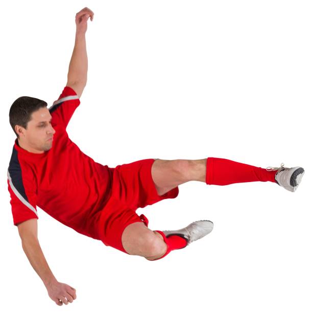 istock Fit football player jumping and kicking 834789564
