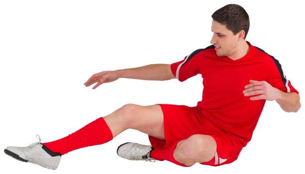 istock Fit football player jumping and kicking 834789812