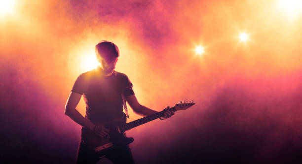 istock Musician playing the guitar on stage 834800912