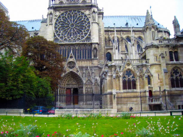 istock flowers on the side of Notre Dame pastel filter 834803246