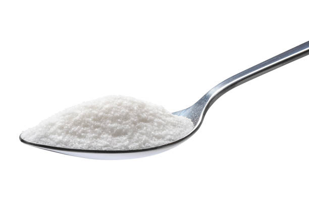 spoon of sugar isolated on white background - sugar spoonful imagens e fotografias de stock