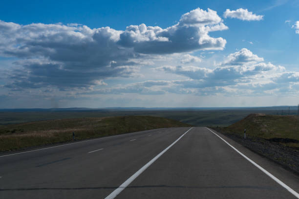 istock Beautiful clouds and straight road 834806824