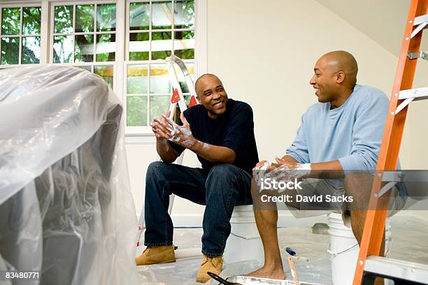 Father And Son Painting Room Talking Stock Photo - Download Image Now - DIY, Black People, Father