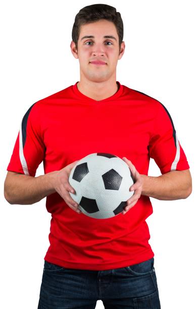 istock Handsome football fan in red jersey 834811018