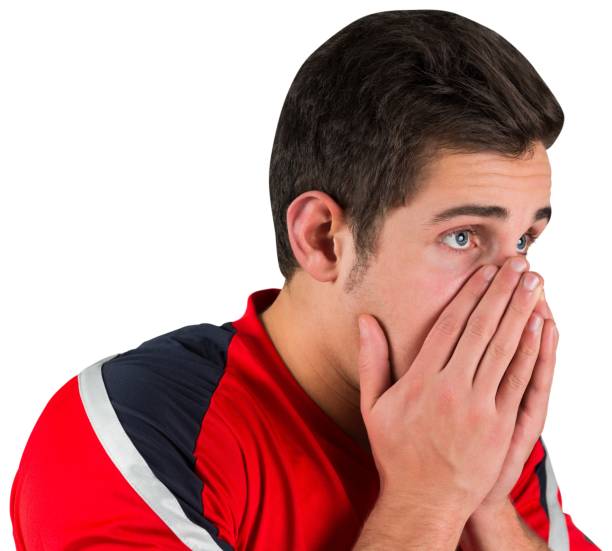 istock Nervous football fan in red 834811242