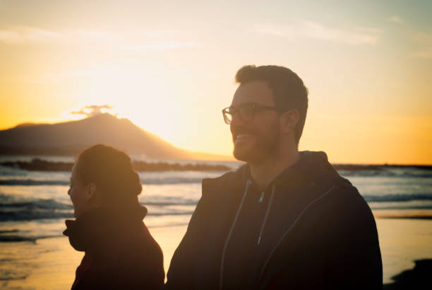 istock Happy couple enjoying the sunset 834817200