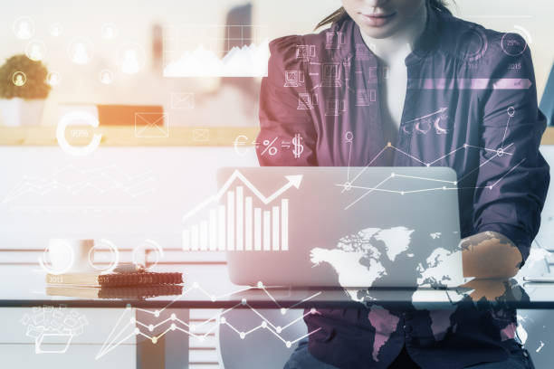 istock Attractive woman using laptop with accounting hologram 834818196