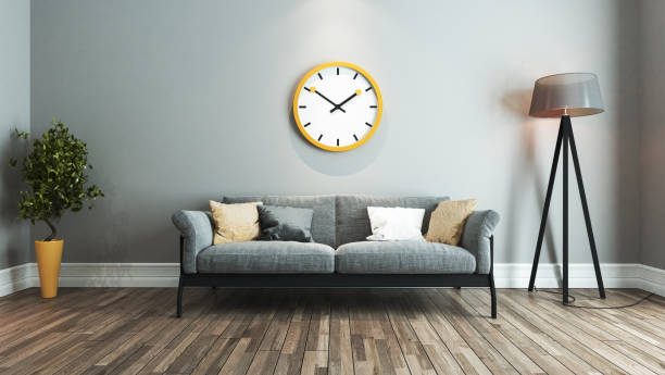 living room interior design idea with big yellow watch stock photo