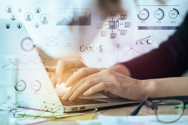 istock Woman using laptop with accounting hologram 834829198