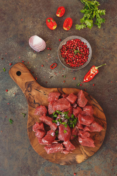 istock Diced raw angus beef meat and ingredients to prepare a stew 834829850