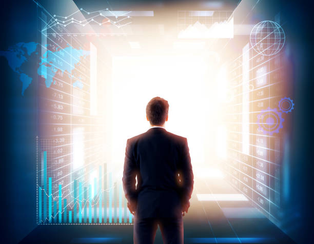 istock Man in glowing room with hologram back 834830746