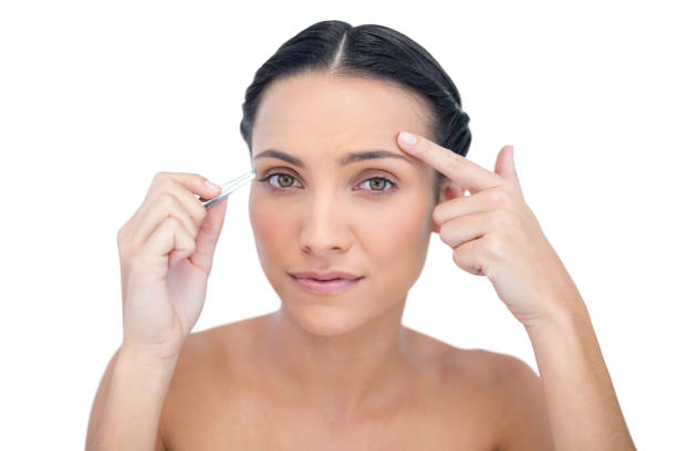 istock Inquisitive young model holding tweezers 834834304
