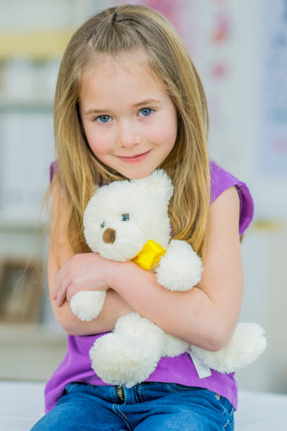 istock Girl With Teddy 834835474
