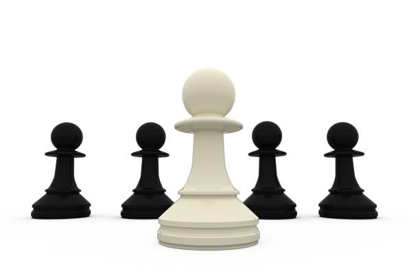 istock White chess pawn standing with black pieces 834836252