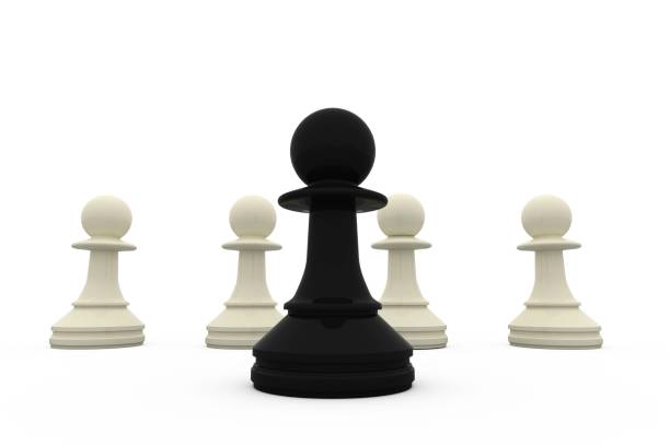 istock Black pawn standing in front of white pawns 834836406