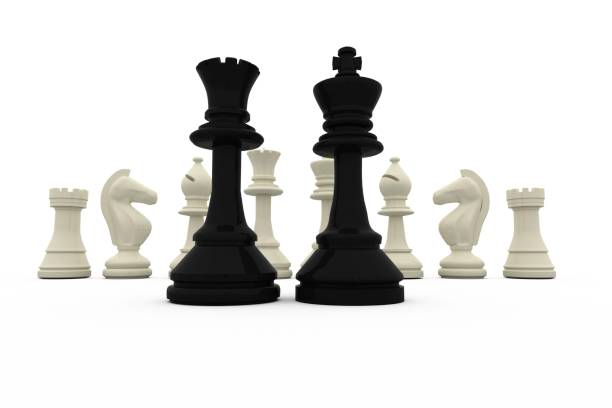 istock Black king and queen standing in front of white pieces 834836646