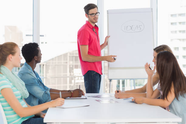 istock Casual business people in office at presentation 834837110