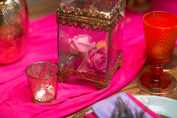 istock A table set with glass decorate in purple and pink 834839126