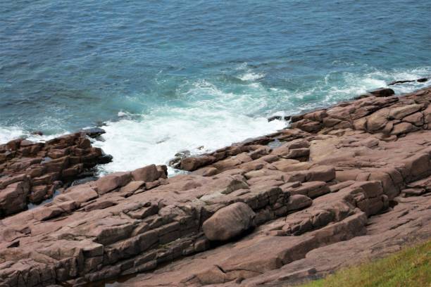istock Waves breaking on the rocks, Cape Spear, Newfoundland. 834854992