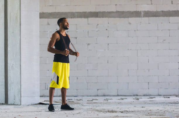 istock Young man exercising outdoors 834855836
