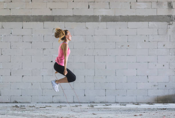 istock Young woman exercising outdoors 834856028
