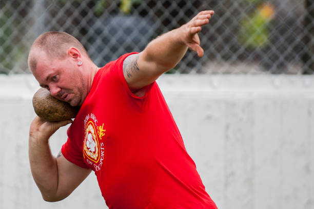 Scottish highland games Winnipeg, MB, Canada - August 15, 2015: sportsmen take part in competition in Scottish heavy games during Folklorama festival organized by Manitoba association of Celtic sports sporran stock pictures, royalty-free photos & images