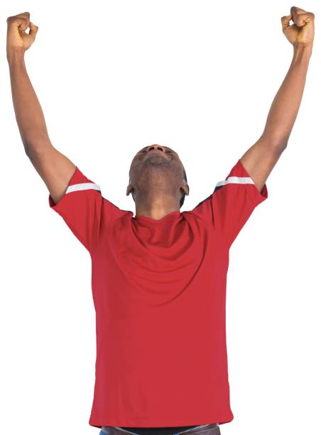 istock Excited handsome football fan cheering 834875476