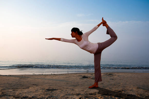 istock Yoga girl on the beach 834876050