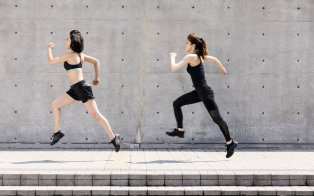 istock Two Asian ladies running outdoors 834882190