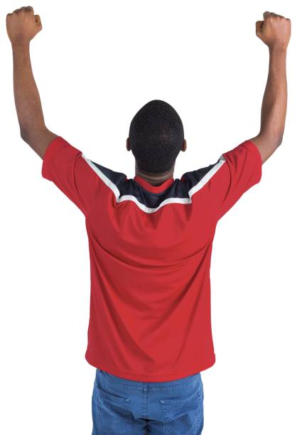 istock Excited handsome football fan cheering 834900470