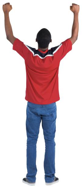 istock Excited handsome football fan cheering 834900490