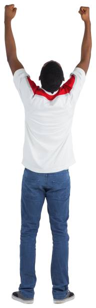 istock Excited handsome football fan cheering 834904080