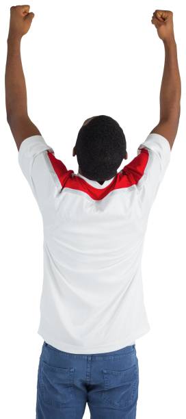 istock Excited handsome football fan cheering 834904112