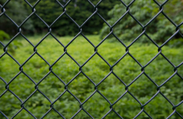 istock Metal fence Sun blur background Abstraction 834924682