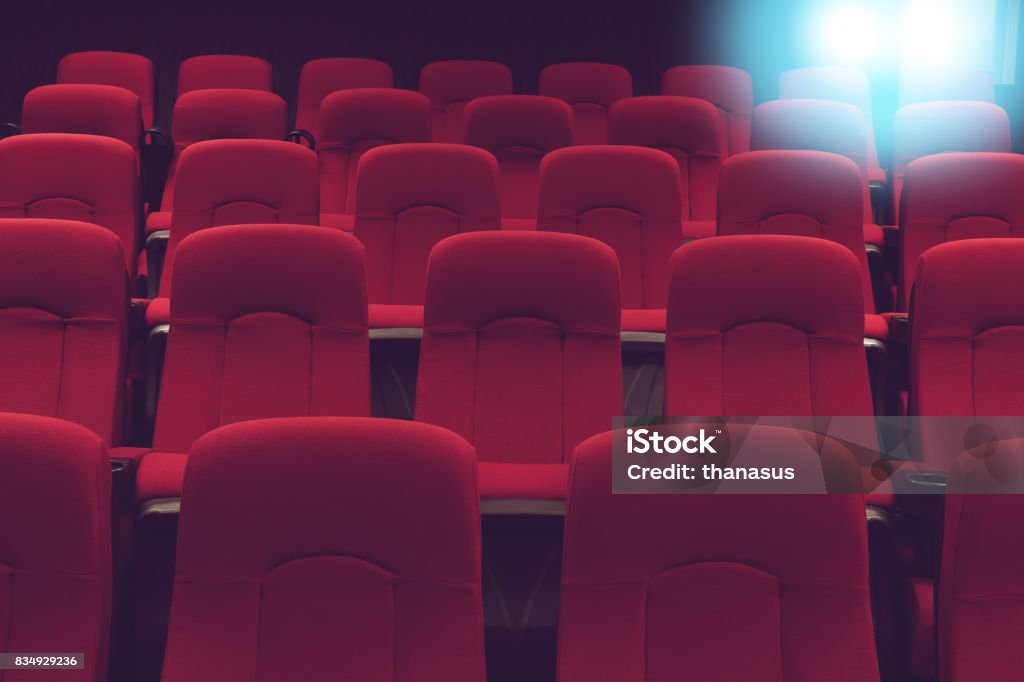movie theater empty auditorium with red seats and blue lighting Seat Stock Photo