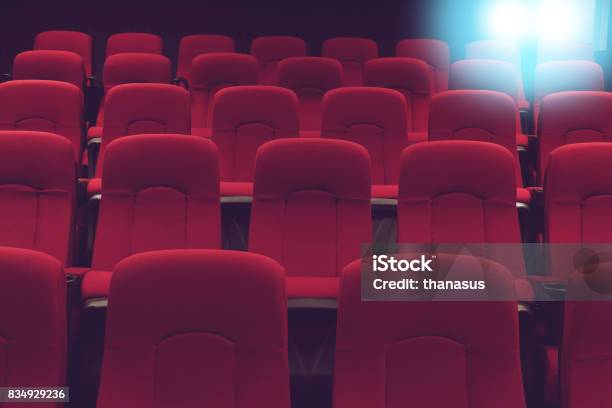 Movie Theater Empty Auditorium With Red Seats And Blue Lighting Stock Photo - Download Image Now