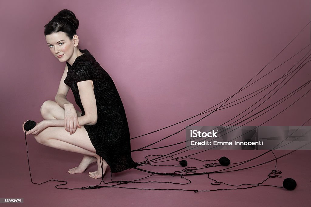 Portrait of a woman wearing her knitted dress  Ball Of Wool Stock Photo