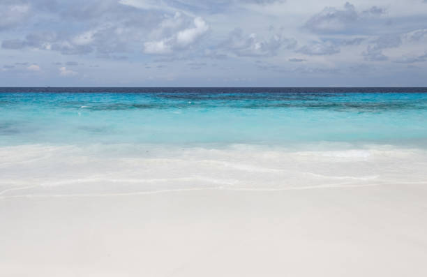 istock White beach sand and beautiful blue sea and sky 834938566
