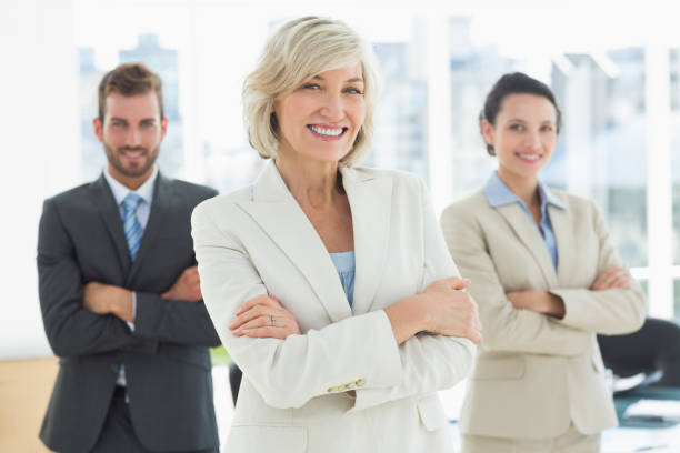 istock Confident business team with arms crossed in office 834949896