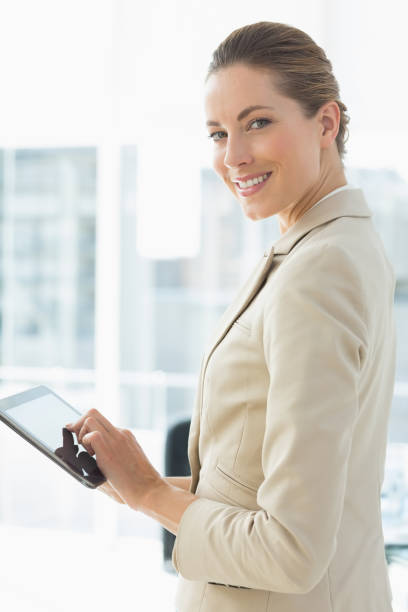 istock Beautiful businesswoman using digital tablet in office 834950732