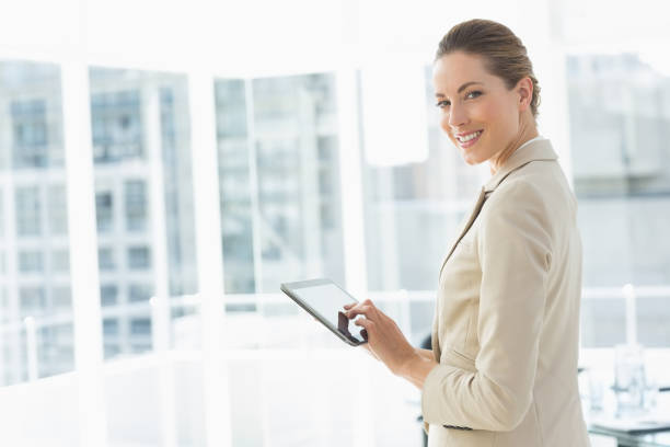istock Beautiful businesswoman using digital tablet in office 834950820