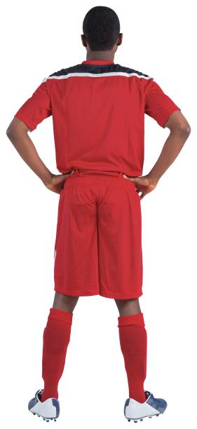 istock Football player in red standing 834957338