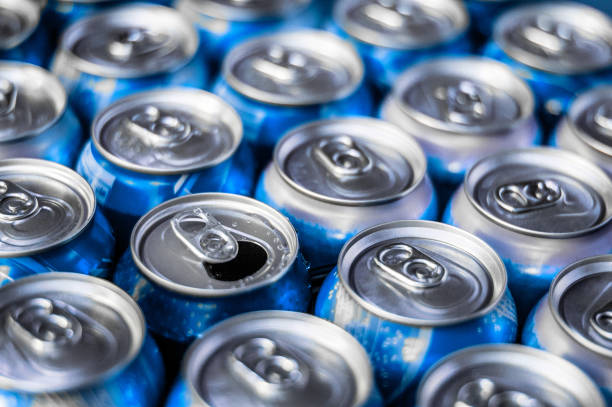 istock Rows of new soda cans and one open 834964718