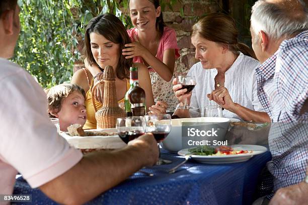 Three Generation Family Eating Lunch Outdoors Stock Photo - Download Image Now - Eating, Hungary, People