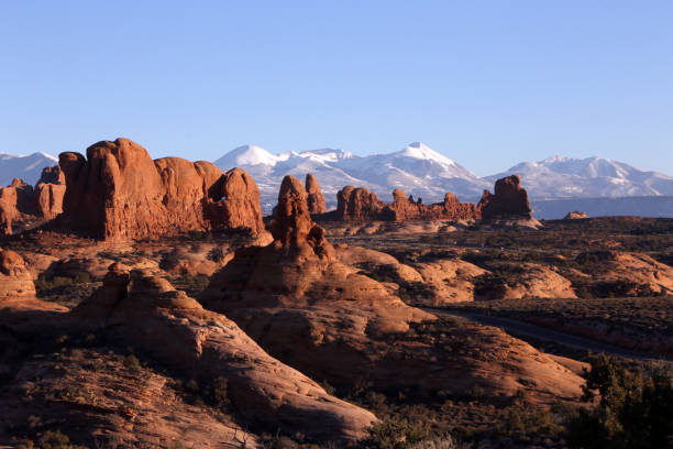 istock Red Rocks and Snow Mountains 834994686