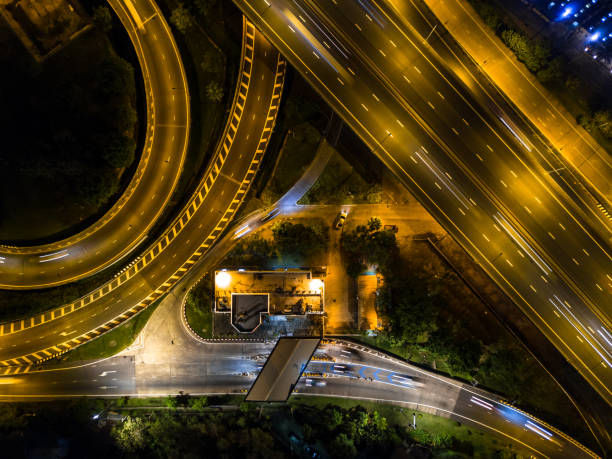 istock Highway night time with car and traffic, Drone view from night sky 835002836