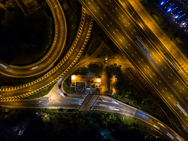 istock Highway night time with car and traffic, Drone view from night sky 835002838
