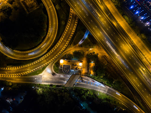 istock Highway night time with car and traffic, Drone view from night sky 835002874