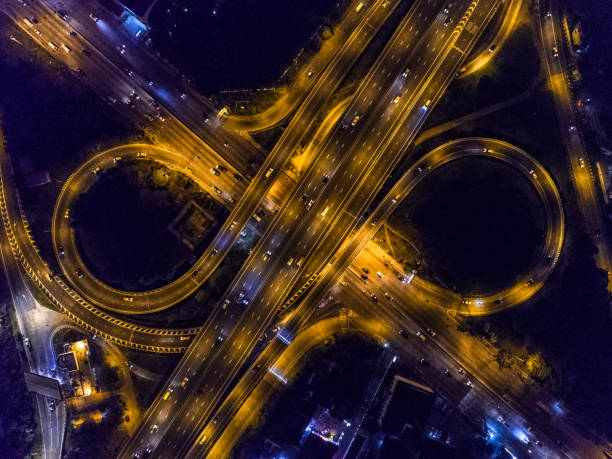 istock Highway night time with car and traffic, Drone view from night sky 835002900